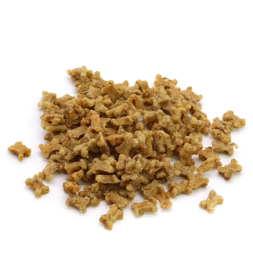 Close-up: A pile of Ossini grain-free treats with fresh meat in the shape of dogs and cats on a white background.