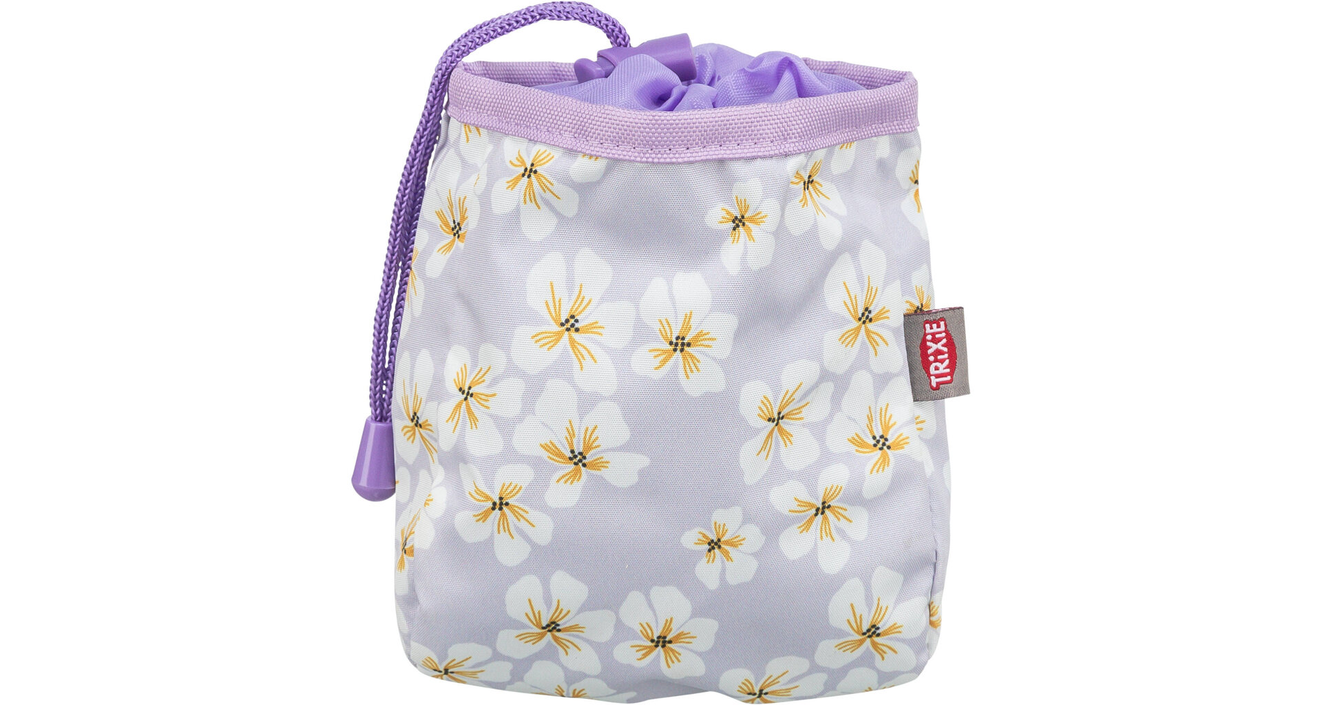 Helllila Stoffbeutel, verziert mit weißen Blüten und gelben Staubblättern. Mit lila Kordelzug zum Verschließen, weichem lila Innenfutter und kleinem rotem Etikett mit der Aufschrift "TRIXIE".