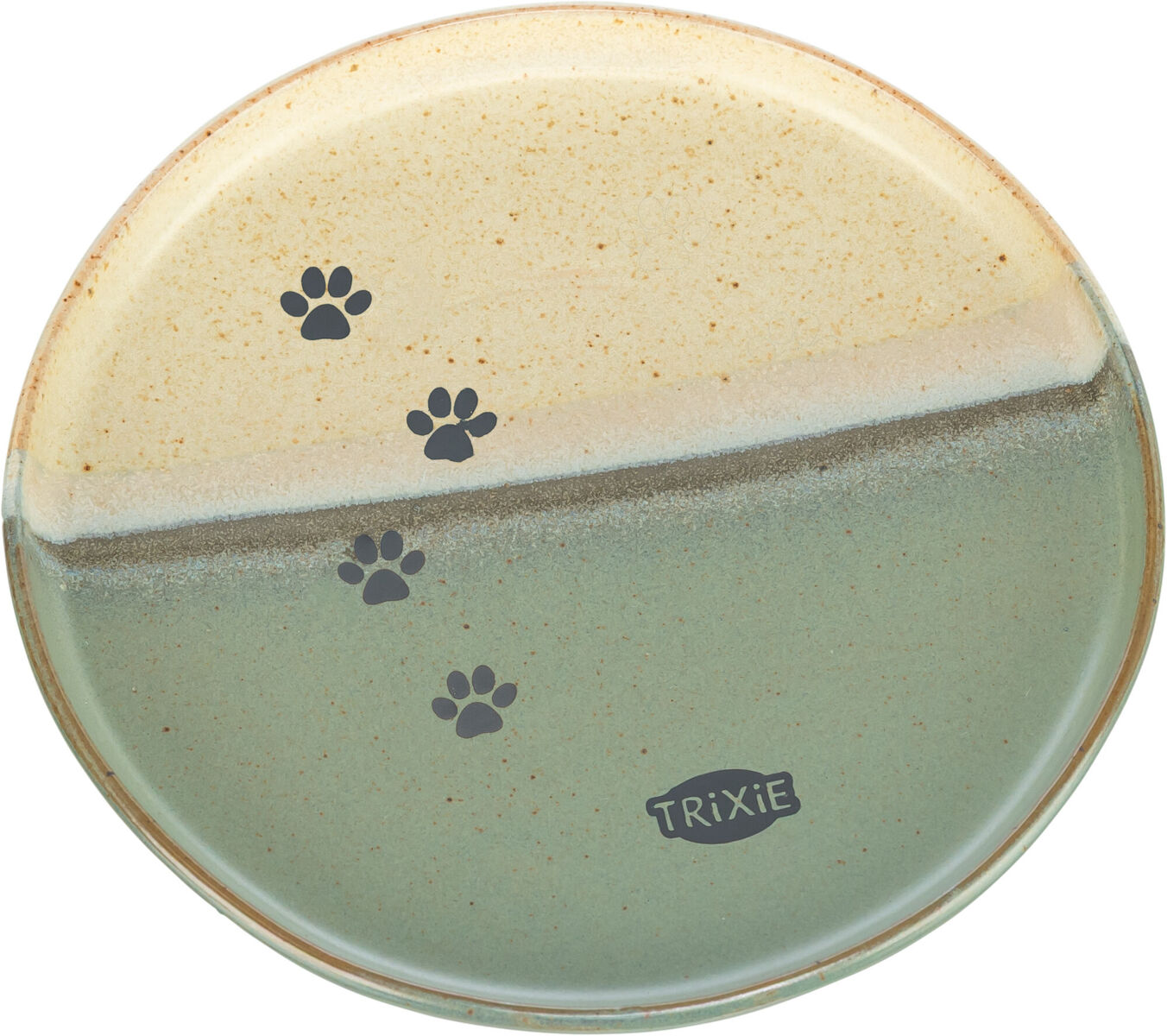 Piatto rotondo in ceramica dal design bicolore: parte superiore crema screziata, parte inferiore verde screziata, separate da una linea scura irregolare. Quattro impronte di zampe grigio scuro in diagonale. In basso a destra "Trixie".