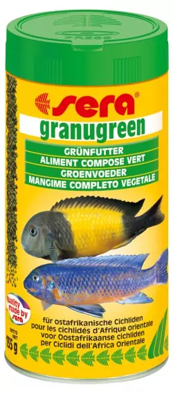 Gelbe Dose Sera Granugreen Fischfutter mit zwei farbenprächtigen Cichliden. Grün beschriftet.