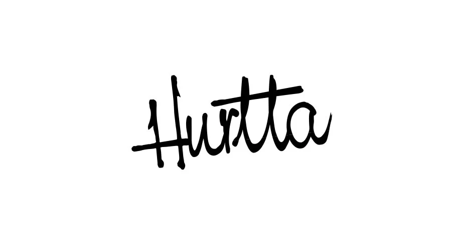 The brand name ‘ Hurtta ’ is centred on a white background in an elegant, handwritten, slightly slanted, deep black font. The letters flow organically into one another and appear dynamic and modern.
