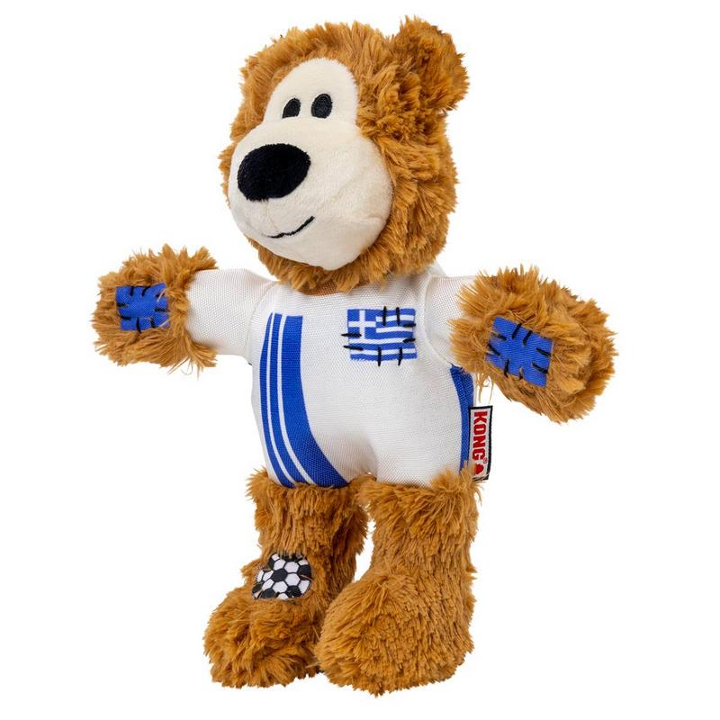 Brauner Plüschbär, steht aufrecht. Weißes Trikot mit blauen Streifen und Griechenland-Flagge. Blaue Kreuzstich-Patches an Armen, Fußball-Patch am linken Fuß. KONG-Label am Arm.