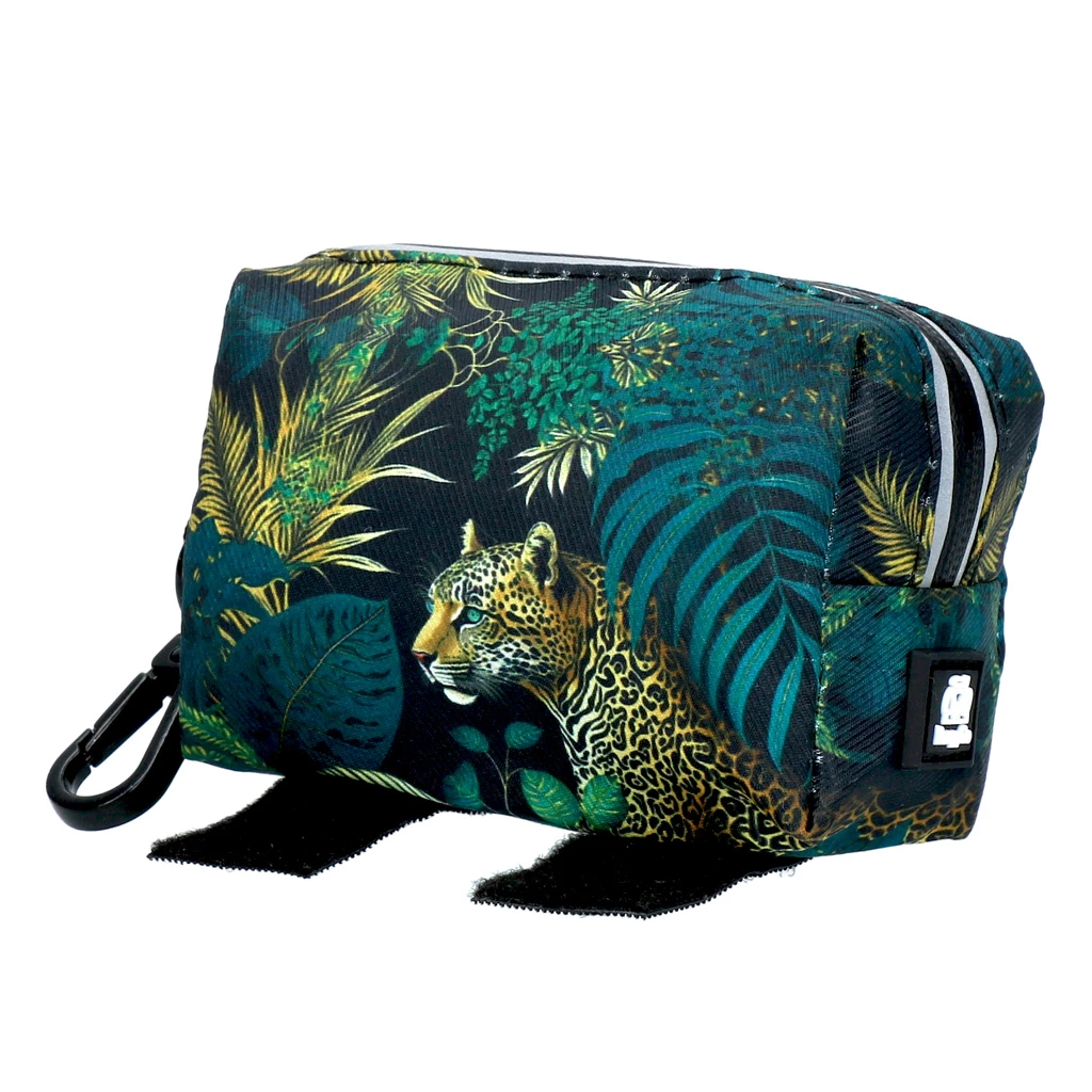Cosmetic bag with jungle motif: leopard among green leaves and plants.
