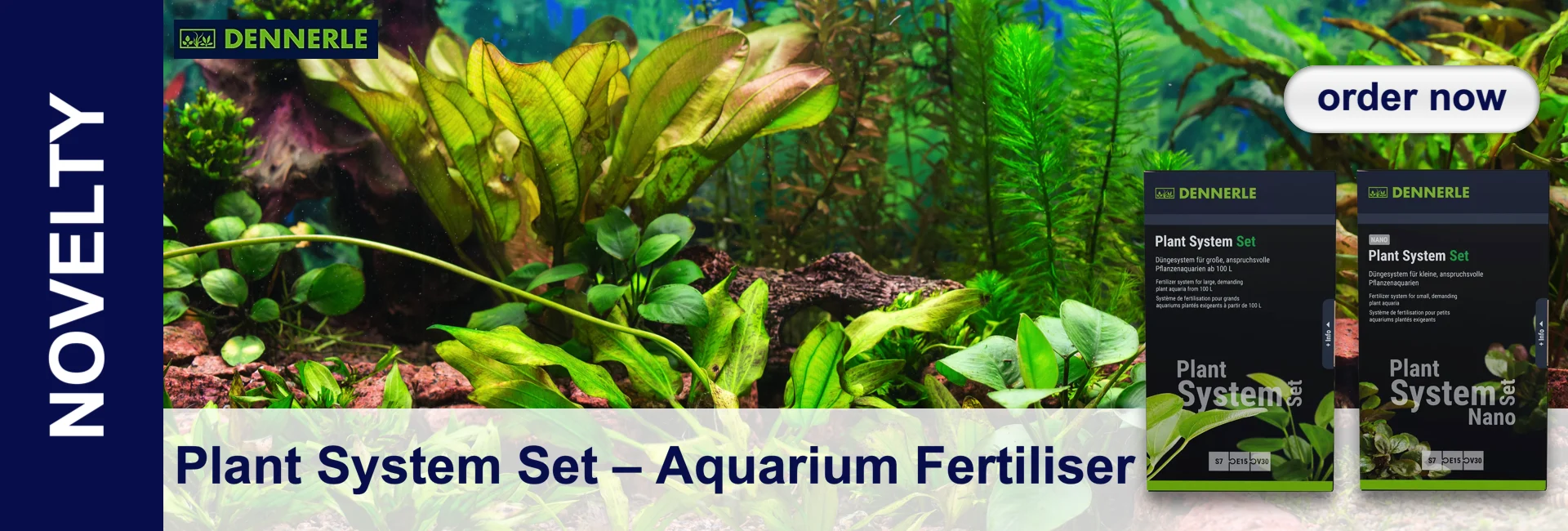 A lush aquarium with green aquatic plants and two packs of "Plant System Set" from Dennerle.