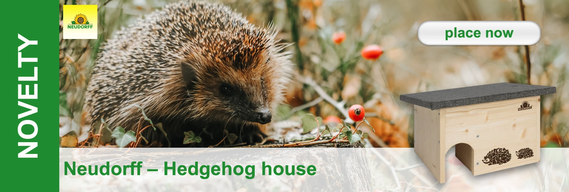 A hedgehog in the leaves next to a small wooden house with a hedgehog silhouette.