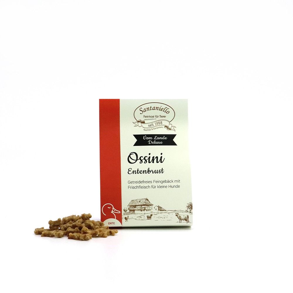 Pack of Ossini dog treats with fresh duck meat and grain-free biscuits, plus a handful of snacks.