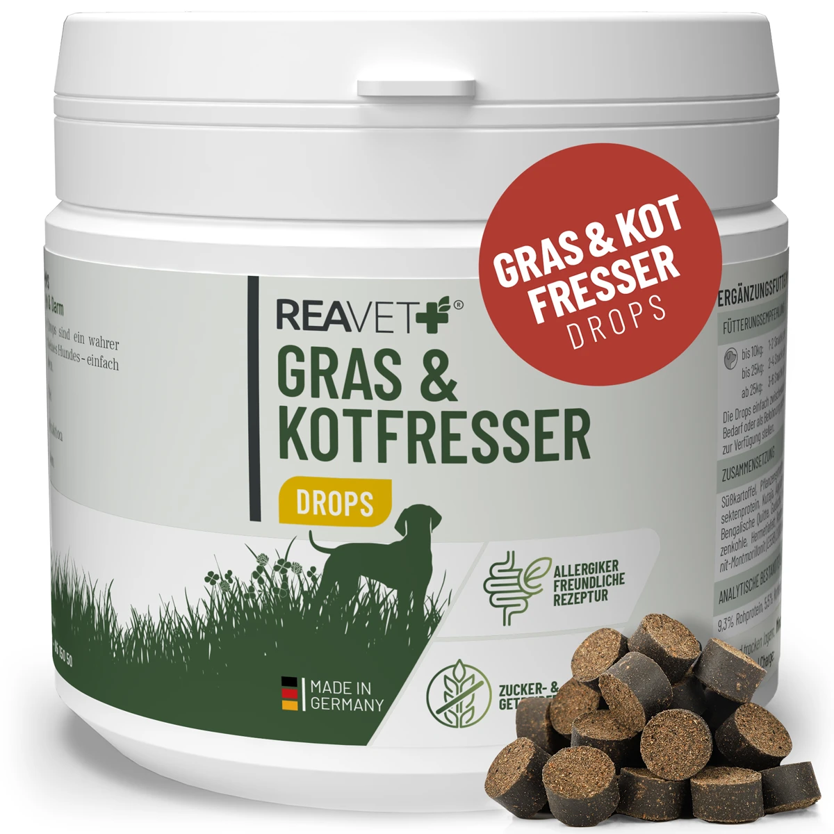 Weiße Dose REAVET+ Gras & Kotfresser Drops für Hunde mit grünem Etikett (Hundesilhouette im Gras, deutsche Flagge), Hinweise „Allergikerfreundliche Rezeptur“ und „Zucker- & Getreidefrei“. Daneben dunkelbraune Drops.
