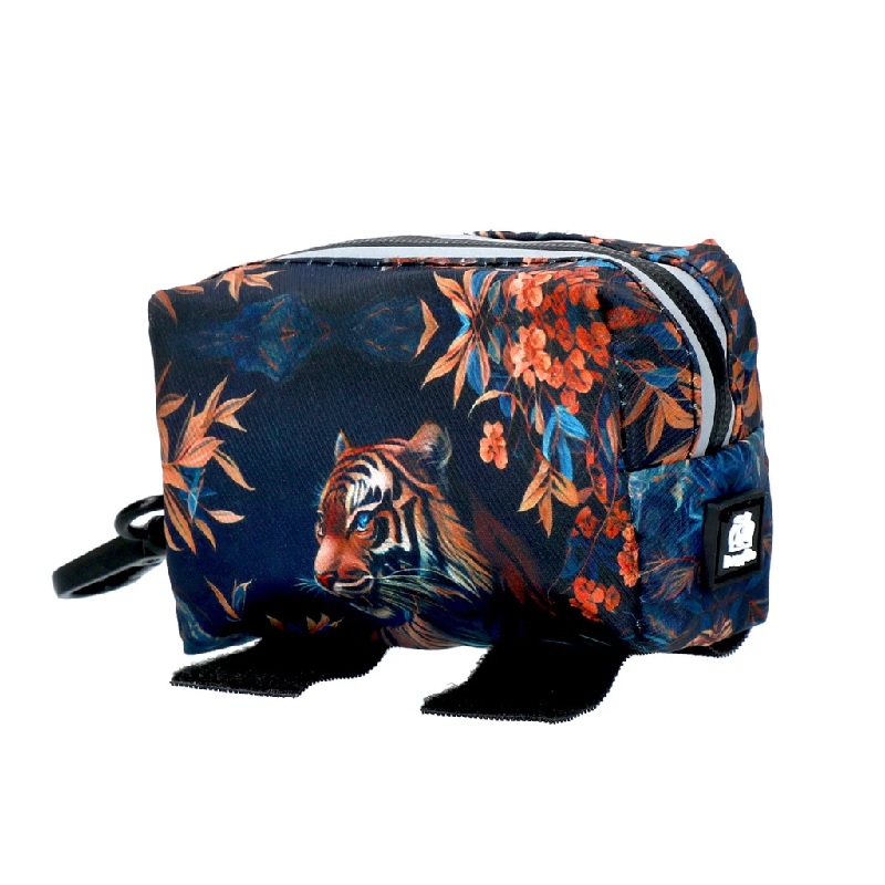 Tiger pattern poo bag dispenser with black Velcro fasteners and elastic band.