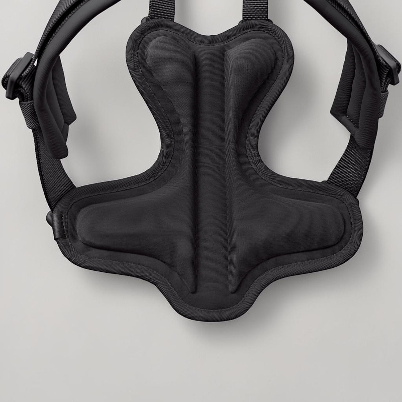 Close-up view from above of the black, ergonomic Hunter ErgoMove Pro dog harness with EVA back padding. Curved shape, wider at the sides and top/bottom, 2 elongated pads, with a central recess to accommodate the spinal canal.