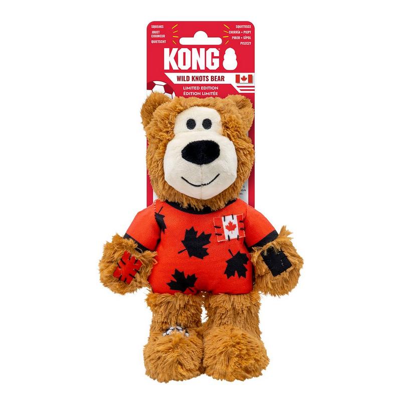 Flauschiger brauner Plüschbär mit leuchtend orangefarbenem Hemd, schwarzen Ahornblattmotiven und kleiner Kanada-Flagge auf der Brust. Weiße Schnauze mit schwarzer Nase und Augen, in roter Verpackung „KONG WILD KNOTS BEAR LIMITED EDITION“.