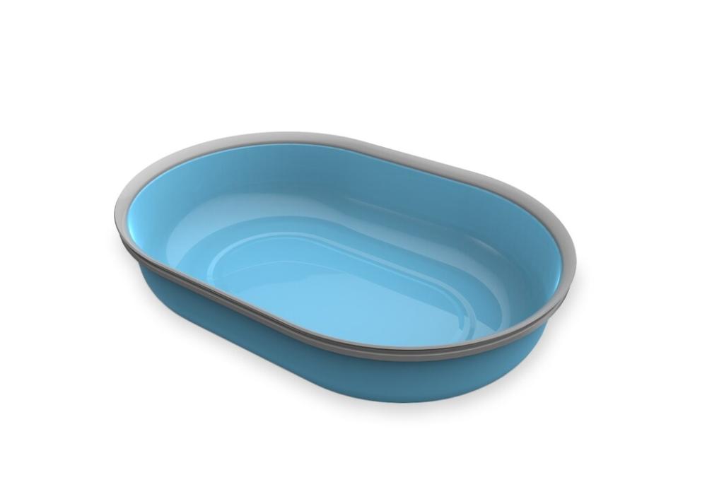 Mangeoire de rechange ovale bleu clair pour un distributeur automatique SureFeed, vue de dessus en biais. Intérieur lisse et légèrement brillant, avec un bord étroit gris clair. Vide et propre, prête à l'emploi.