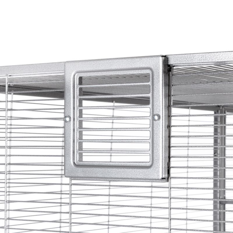 Detailed view of an aviary with a rectangular feeding flap with horizontal struts.