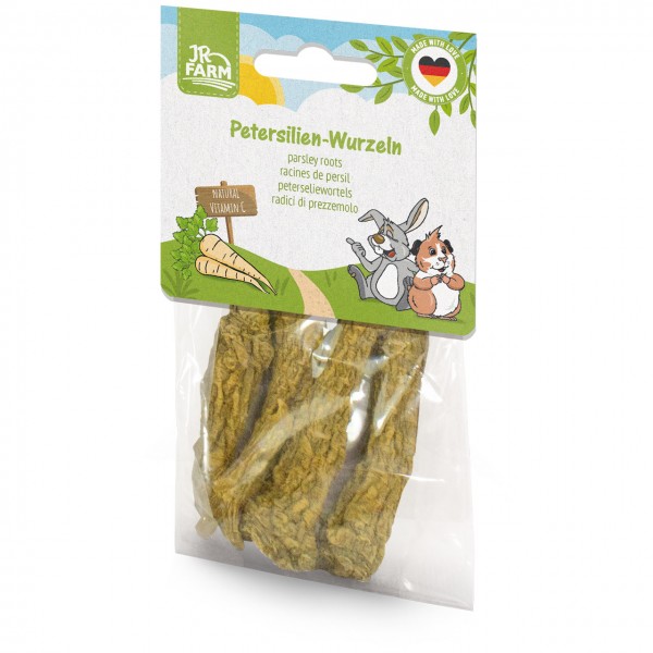 JR Farm Parsley Roots, a pet snack in a transparent bag containing dried pieces of parsley root. The colourful cardboard box featuring a rabbit and a guinea pig advertises ‘Natural Vitamin C’ and ‘Made in Germany’.