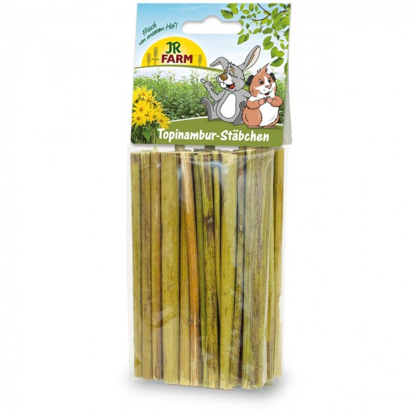 Bâtonnets de topinambour, des friandises naturelles pour les petits animaux de compagnie. Conditionnés en paquet transparent, de couleur vert-brunâtre. Sur le dessus, un lapin souriant et un cochon d'Inde devant un champ de tournesols, JR Farm.