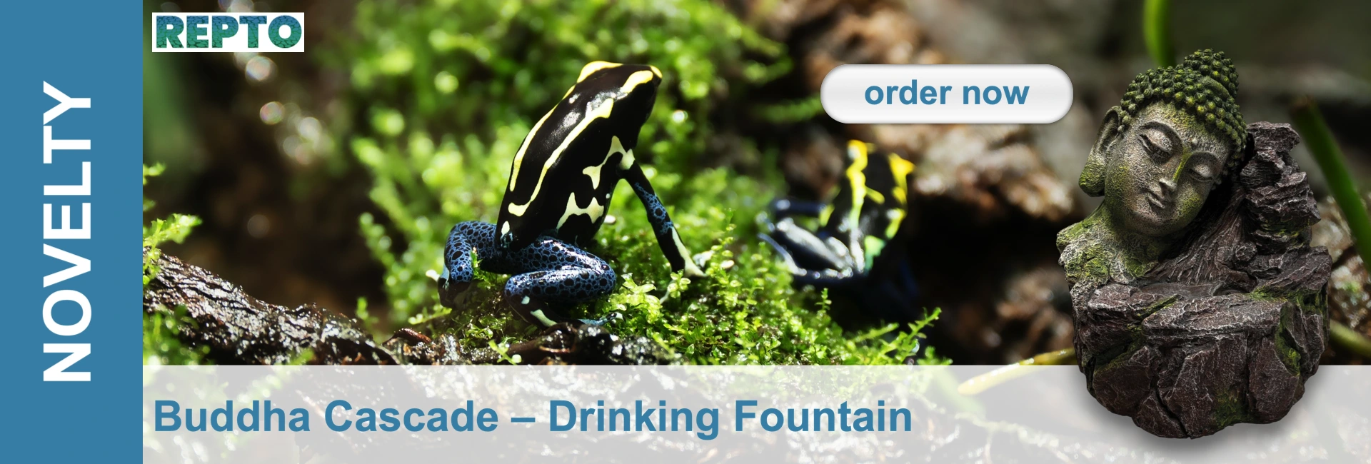 A black-and-yellow striped frog with blue legs sits on light green moss. Another frog is blurred in the background. On the right, a moss-covered Buddha head statue made of dark stone forms part of a drinking fountain. Product from Repto.