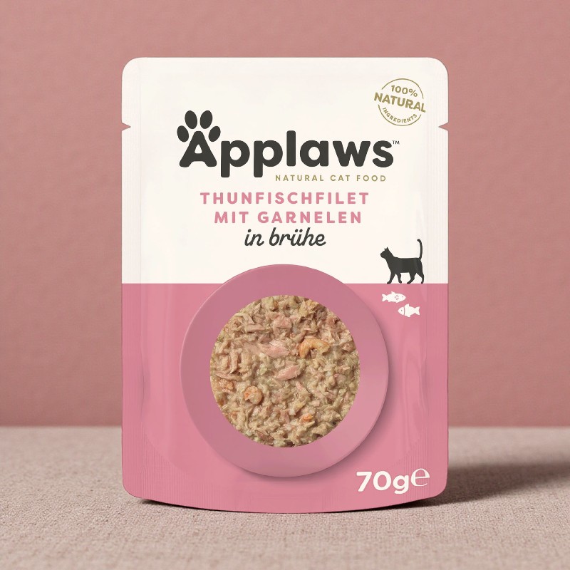 Emballage Applaws Nourriture pour chats filet de thon avec crevettes. Logo en haut, illustration de l'aliment dans un cercle rose en bas.