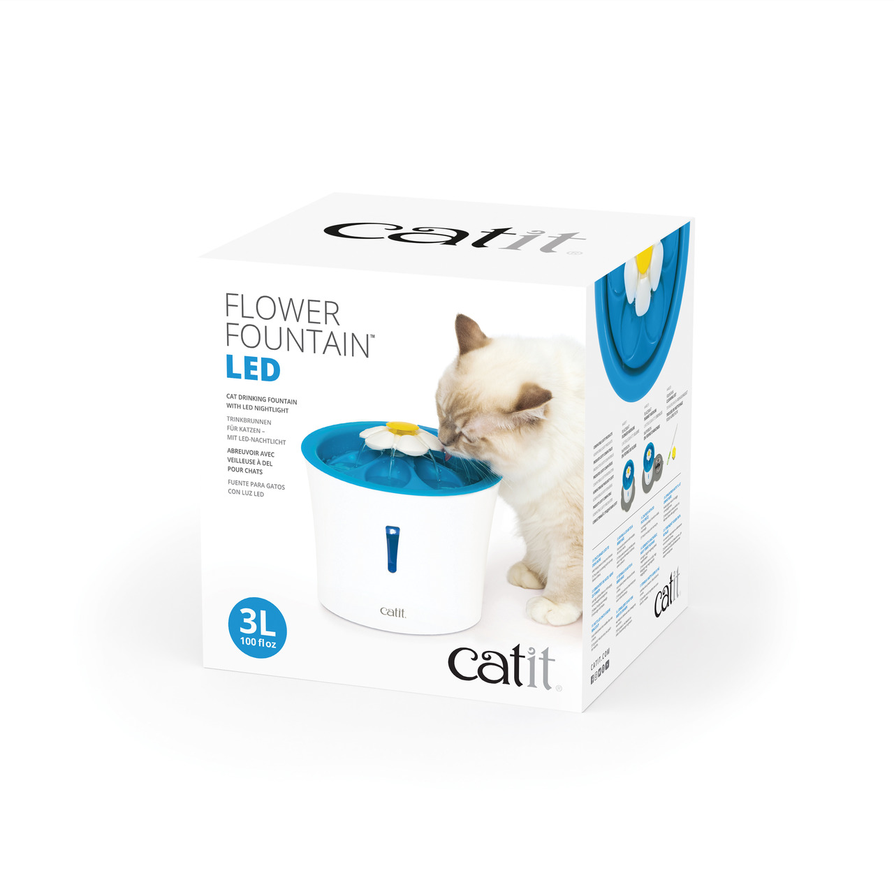 Verpackung eines Catit LED-Trinkbrunnen Flower mit Katze, die daraus trinkt. Der Trinkbrunnen ist weiß mit blauer Blüte.