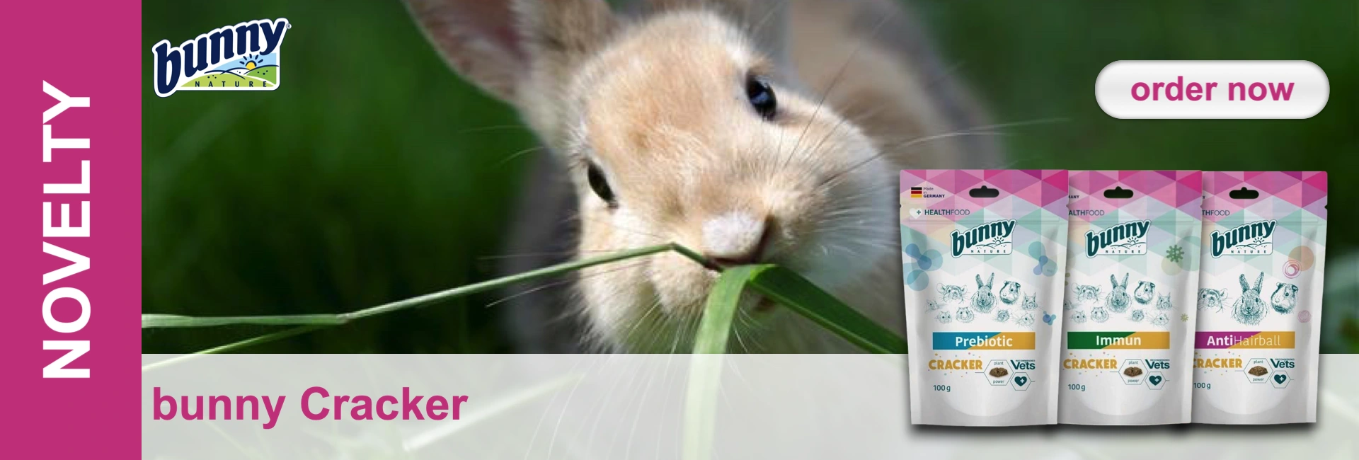 A beige rabbit eats grass in front of three packets of bunny crackers. A button with "Order Now" at the top right.