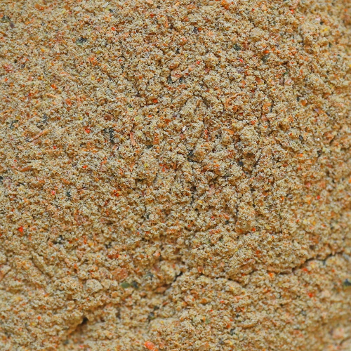 Primo piano di DuplaRin Omni Gel, una pasta di mangime granulare di colore marrone chiaro.