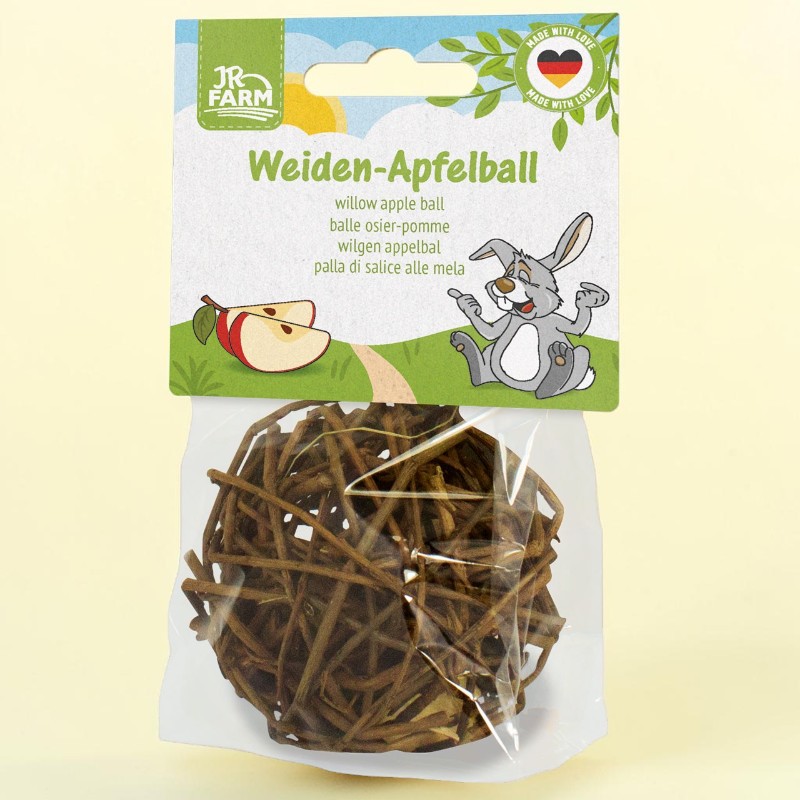 JR Farm Willow Apple Ball for small animals. Transparent packaging containing a spherical ball made of brown, woven willow twigs. Cardboard header featuring the brand name, “Willow Apple Ball”, a cartoon rabbit, pieces of apple and “Made with Love”.