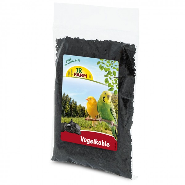 A transparent bag of black, granulated bird charcoal against a white background. The label shows the ‘JR Farm’ logo, a yellow canary and a green-and-yellow budgerigar on a forest sky, with red ‘Vogelkohle’.