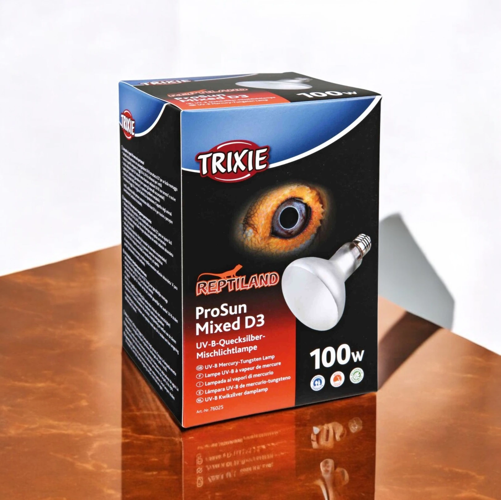 Packaging for an Trixie Mini Pro Sun Mixed D3 100-watt lamp, featuring a reptile’s eye and an image of the lamp.