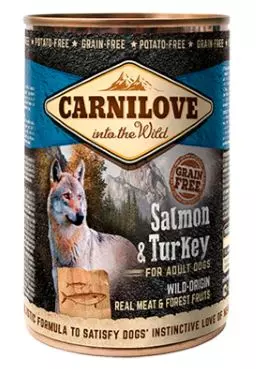 Lattina di Carnilove Adult Salmon & Turkey con lupo, montagne, pesce in legno in rilievo e informazioni sul prodotto.
