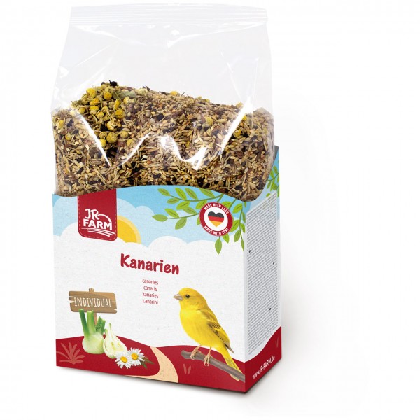 Sachet transparent arborant le logo JR Farm sur fond blanc, rempli de graines, de fleurs et d'herbes. Étiquette colorée représentant un canari jaune, du fenouil, des pâquerettes et la mention « INDIVIDUAL ».
