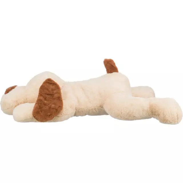 Reclining, beige-brown plush dog Benny with brown ears and tail, a cuddly toy.