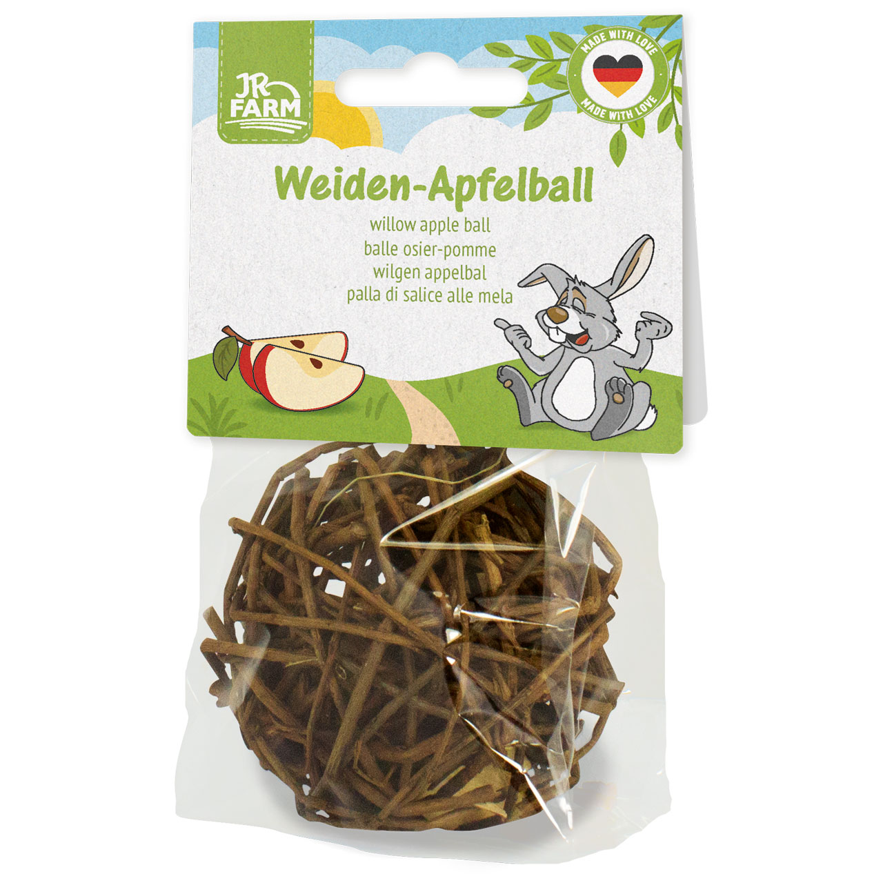 Production packaging for a JR Farm willow apple ball. Front: a happy rabbit on a green dirt track under a sunny sky, with two apple slices beside it. At the bottom, in a transparent bag, is a ball made of dark willow twigs.