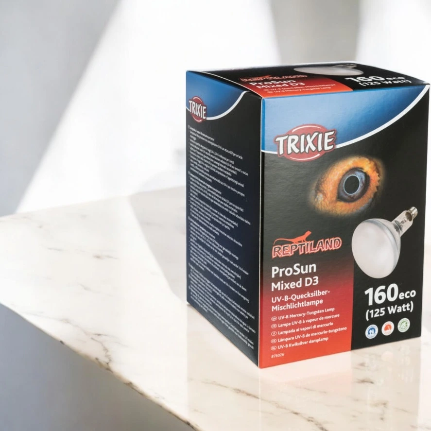 Packaging for the Trixie Mini Pro Sun Mixed D3 lamp, featuring an image of the lamp and a reptile’s eye.