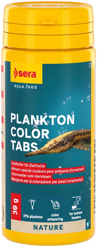Yellow container containing ‘ Sera ’ Plankton Colour Tabs for aquarium fish. The dark blue label shows a brownish-striped bottom-dwelling fish with long barbels, surrounded by air bubbles. Plankton-based, colour-enhancing food.