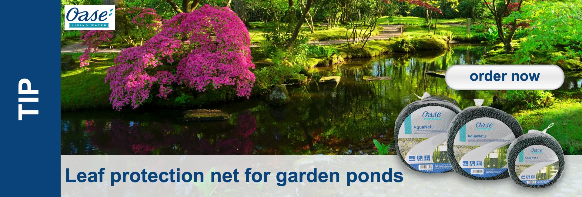 A tranquil garden pond, surrounded by lush green foliage and a large rhododendron in bright pink bloom, its reflection visible in the clear water. In the foreground are three packaged Oase AquaNet leaf protection nets.