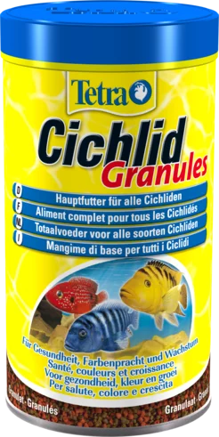 Gelbe Dose Tetra Cichlid Granules mit Fischen. Granulat sichtbar am unteren Rand.