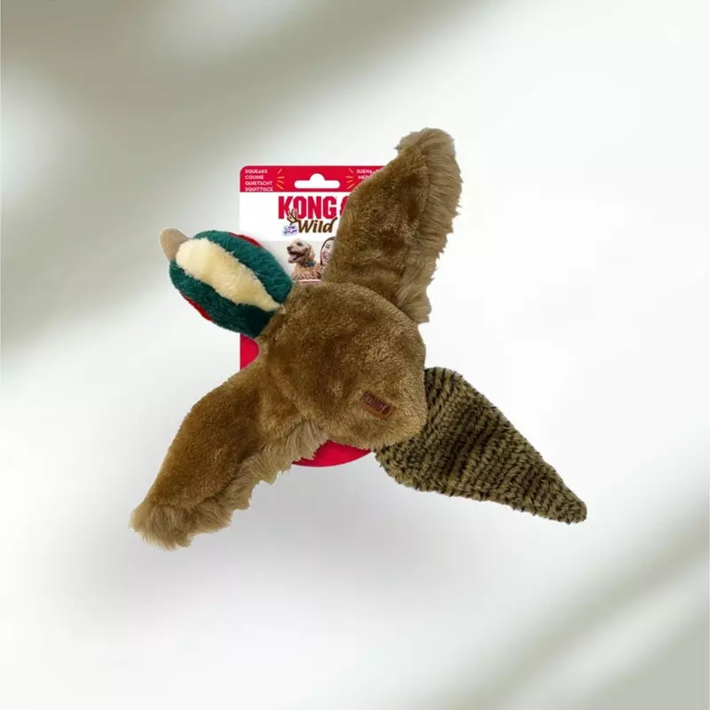 Morbido giocattolo per cani in peluche marrone "Kong" con motivo a forma di anatra e confezione su sfondo chiaro.