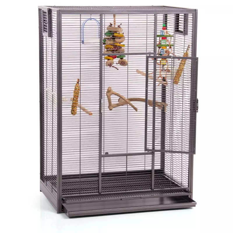 Large, grey parrot cage with toys and branches, open door.