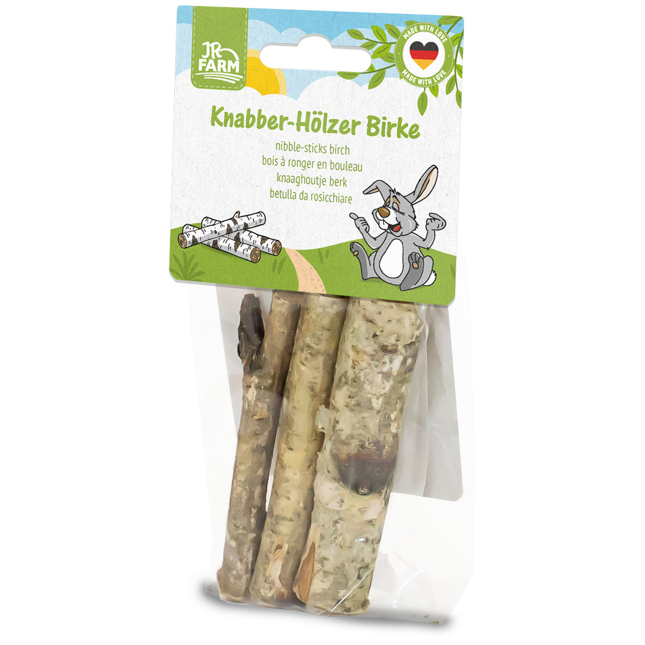 JR Farm Birch Chew Sticks in transparent packaging. Green and white label featuring a smiling rabbit, birch logs and a ‘Made with Love’ heart with the German flag. The bag contains four natural birch sticks.