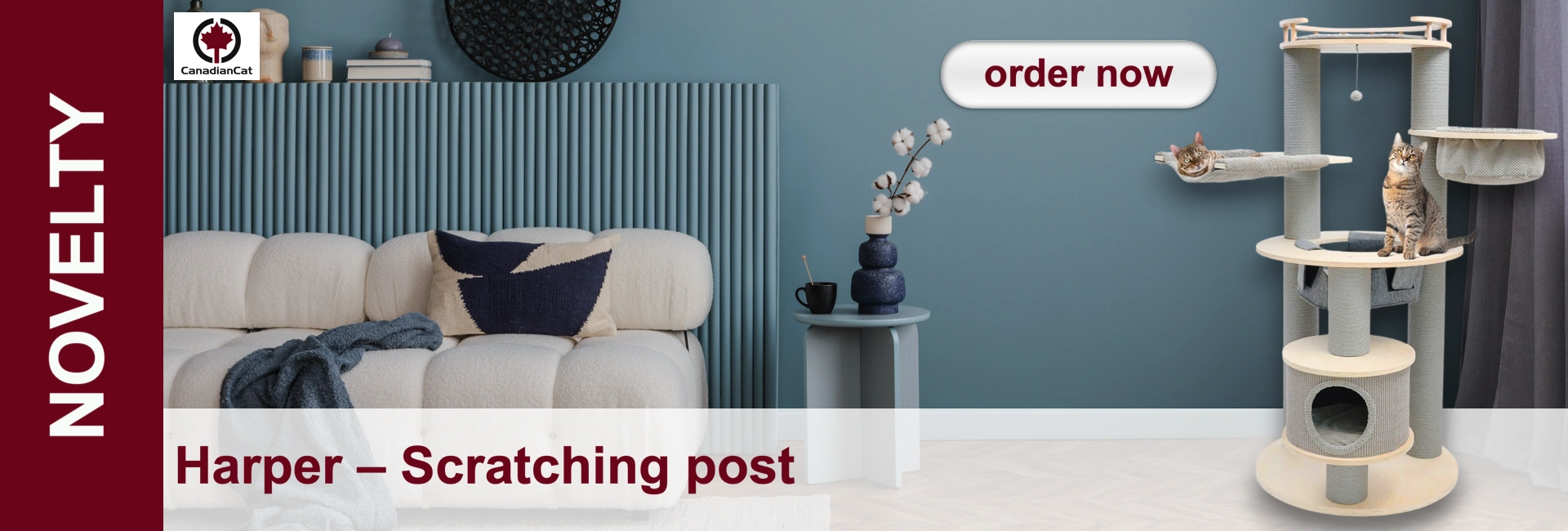 Living room with sofa, side table, decorations and a multi-storey cat scratching post with two cats on it.