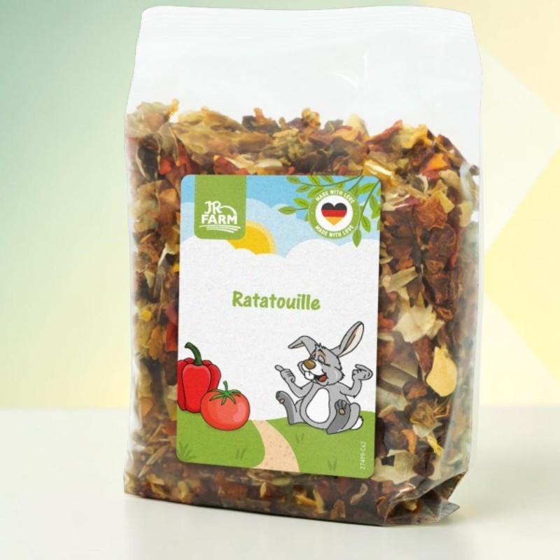 Transparent bag containing dried ratatouille vegetable pieces such as peppers and onions. Label: JR Farm, Ratatouille, cartoon rabbit, red pepper, tomato and the ‘MADE WITH LOVE’ seal featuring the German flag.